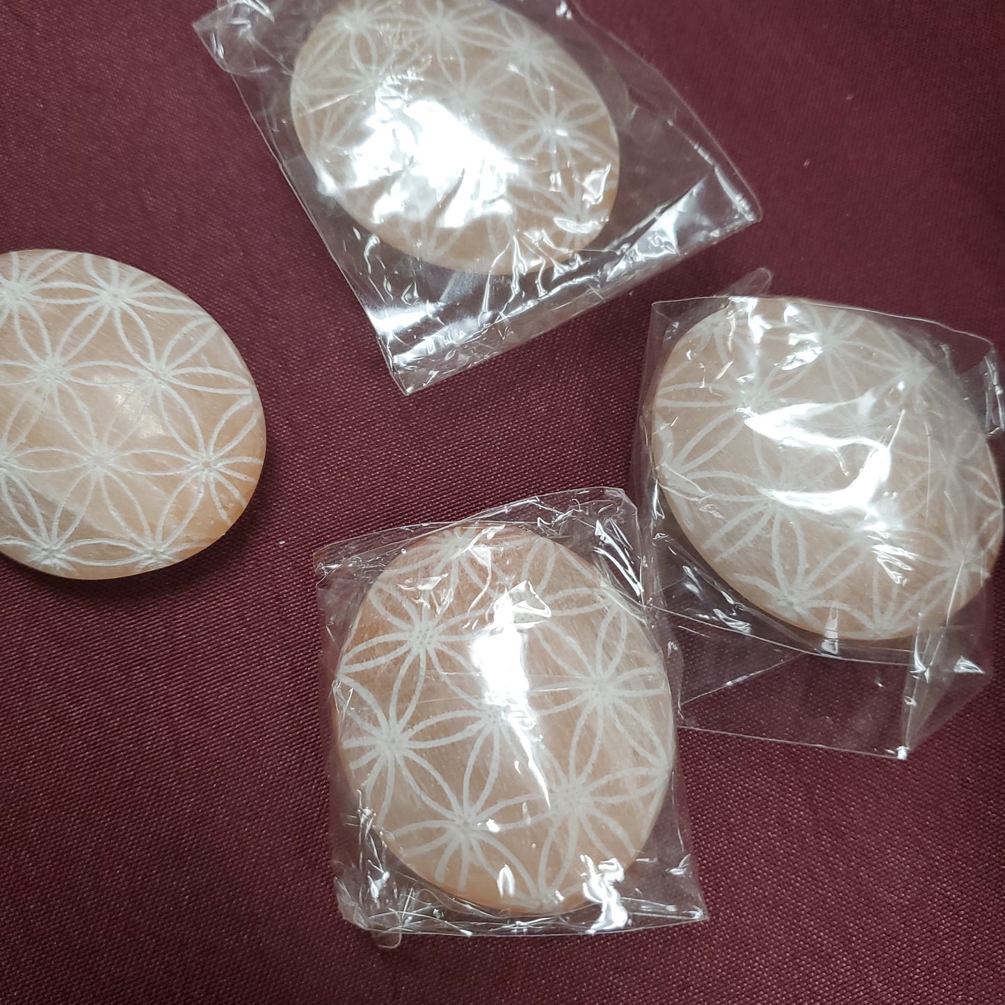 Engraved Orange Selenite Flower of Life Palm Stone